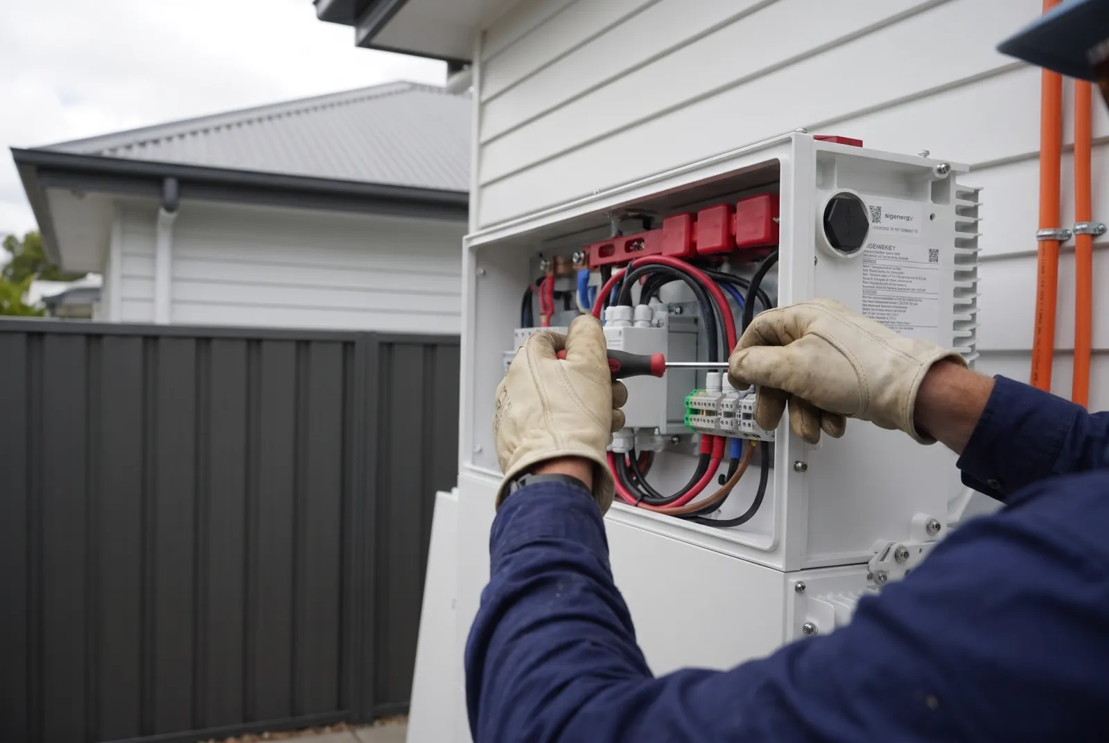 An electrician wiring the battery gateway