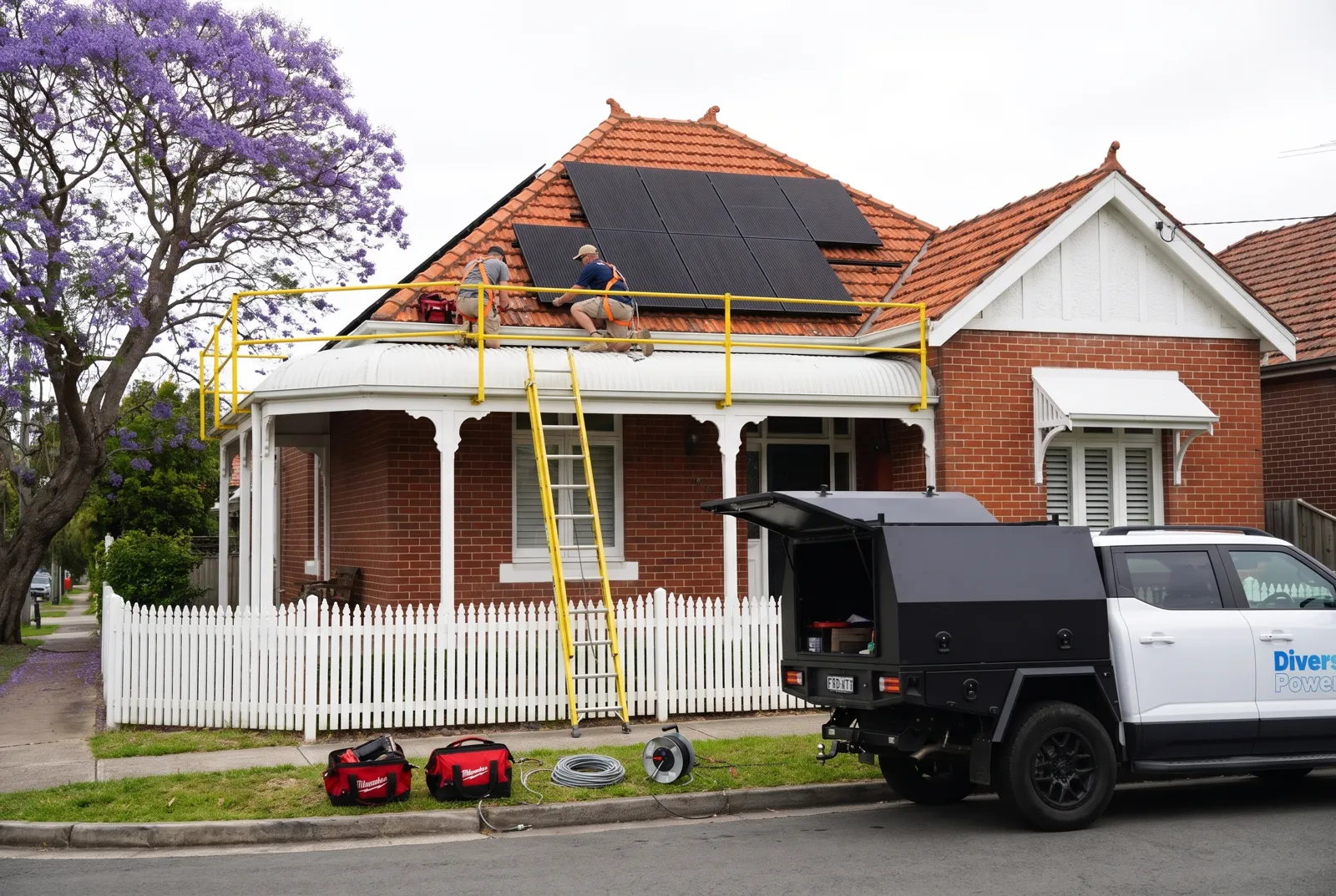 Solar panels being fitted to a tiled federation home